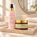 PRANA Pure Rose Water Toning Mist and Turmeric & Sandalwood Vitamin C Clay Mask on a beige stone tray